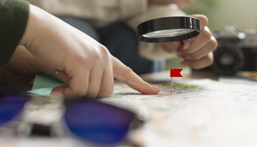close-up-hand-having-magnifying-glass
